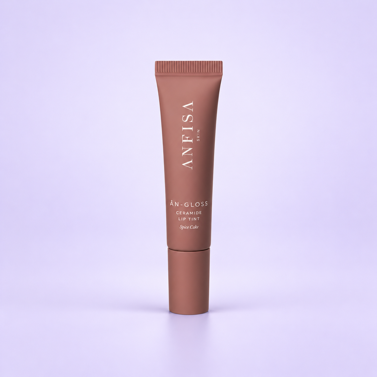 ANFISA ÂN GLOSS Ceramide Lip Tint Spice Cake on a soft lavender background